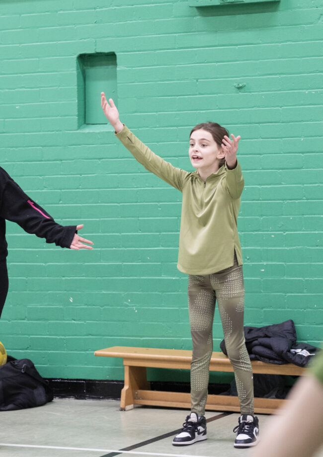 Young person playing football in The Bronte Youth and Community Centre sports hall