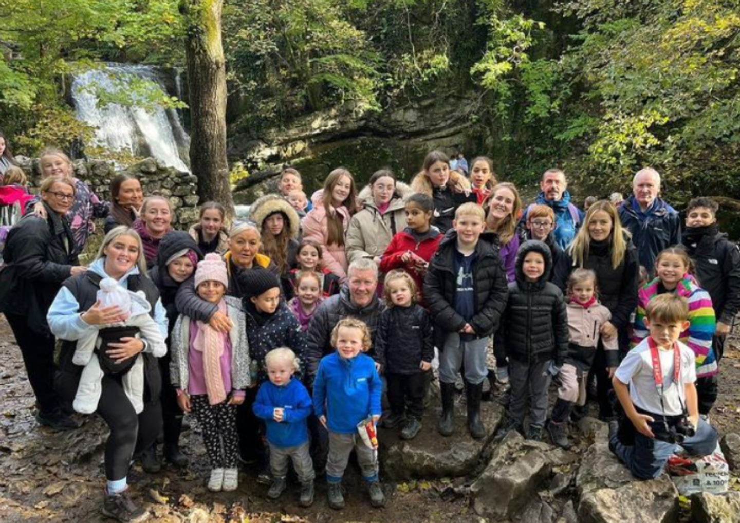 Group photo of young people, staff and volunteers enjoying a walk through the Yorkshire countryside during a Bronte Youth and Community Centre residential