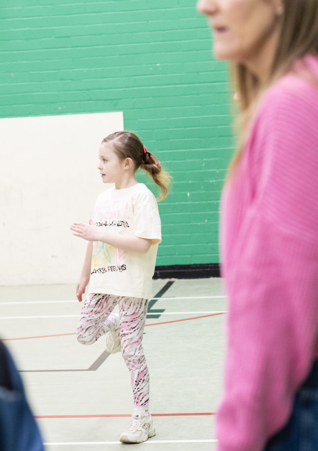 Young girl playing sports in the sports hall at The Bronte Youth and Community Centre based in Liverpool City Centre
