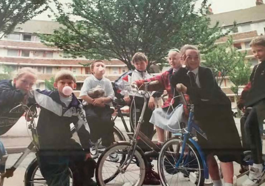 Historical photo of The Bronte Youth and Community Centre members posed in the Bullring in Liverpool City Centre on bikes