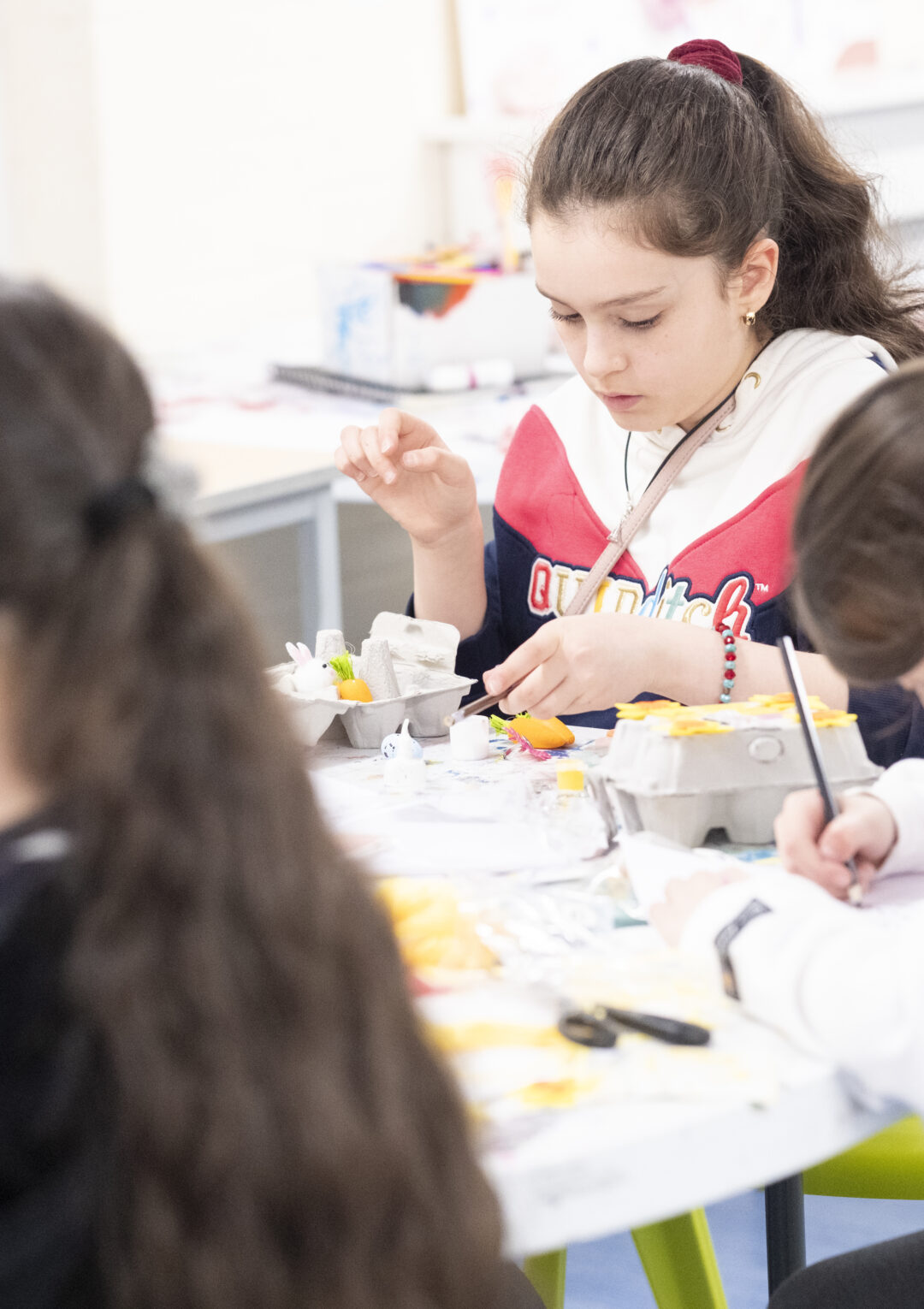 A group of young people doing crafts and painting in The Bronte Youth and community Centre, based in Liverpool City Centre near the Bullring