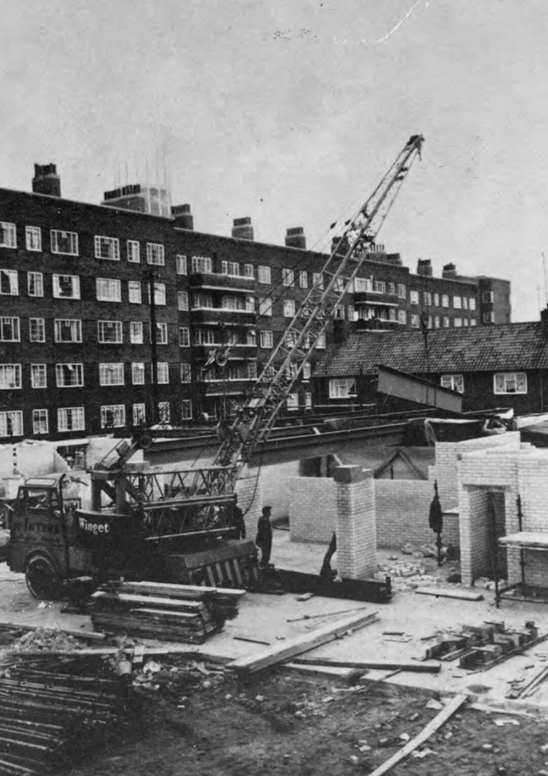 Black and white image of the Bronte Youth and Community Centre construction site before it opened in the 1970's with the Bullring in the background based in Liverpool City Centre