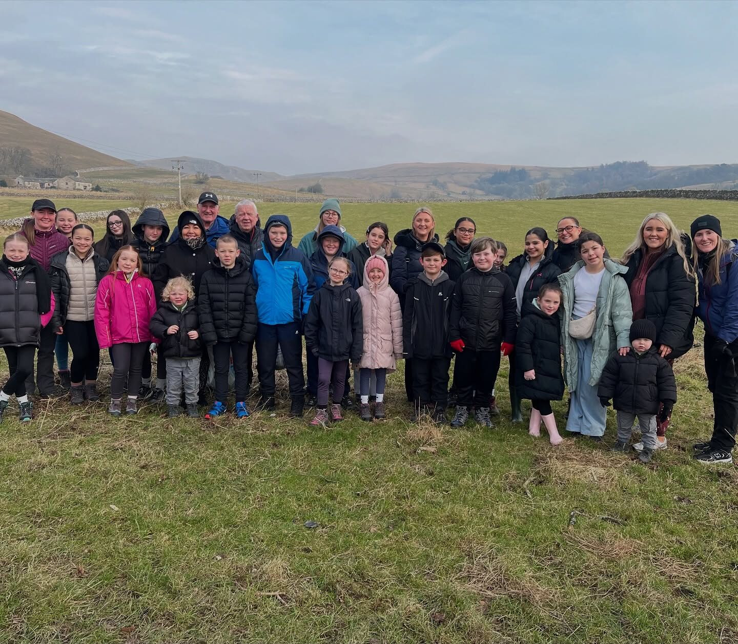 A group of young people, staff and volunteers during a walk in Yorkshire on residential with the Bronte Youth and Community Centre