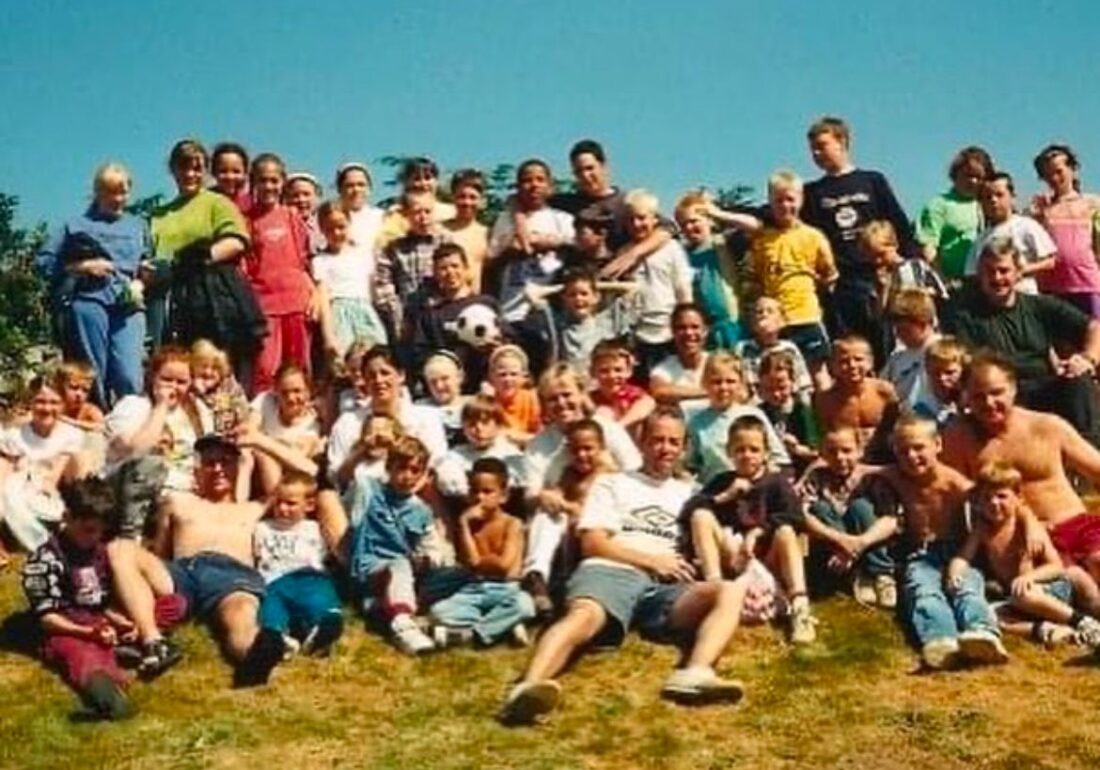 Vintage group photo of all the young people, staff and volunteers on a Bronte Youth Club residential trip to Yorkshire.